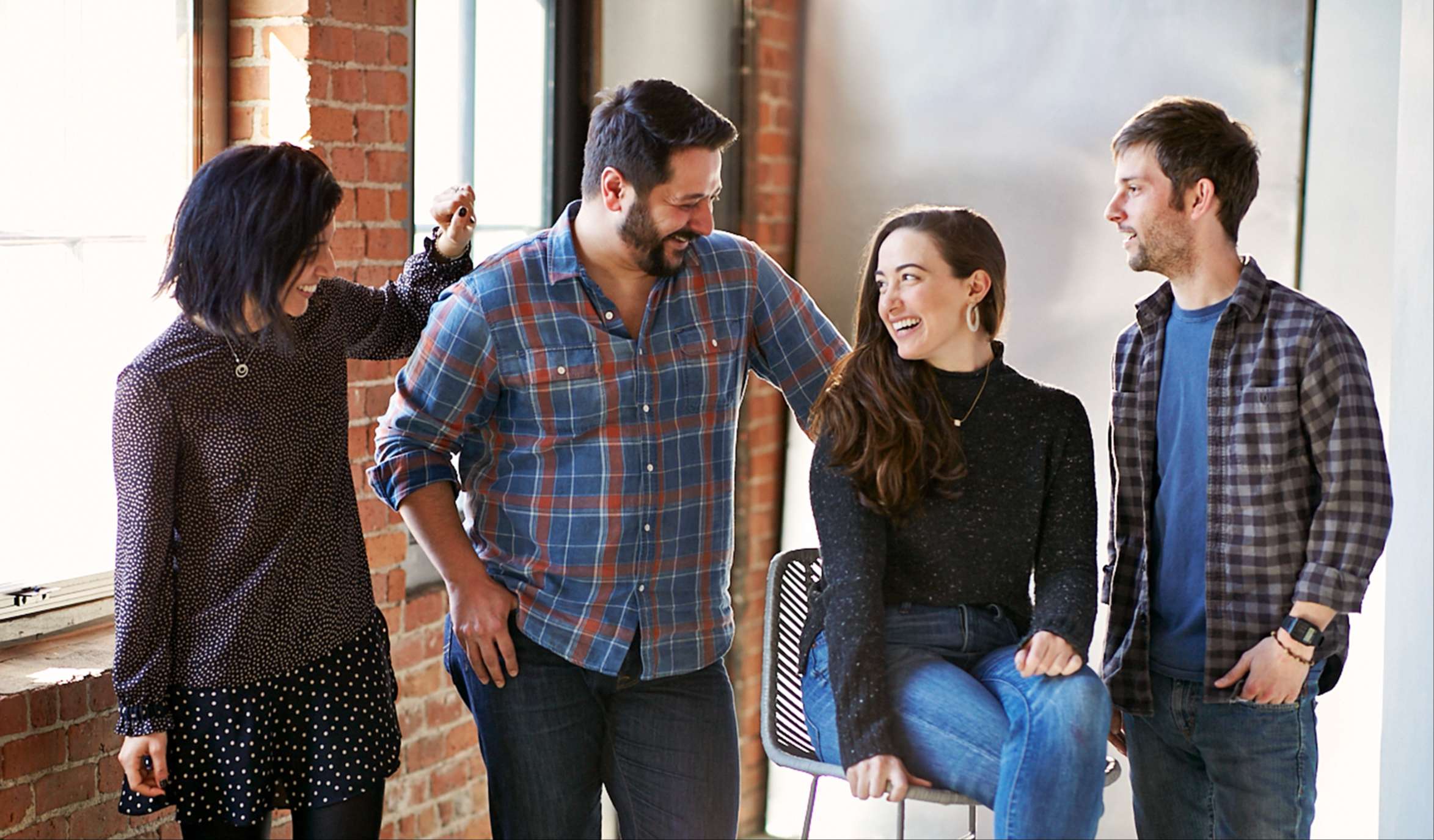 a group of people standing around a person