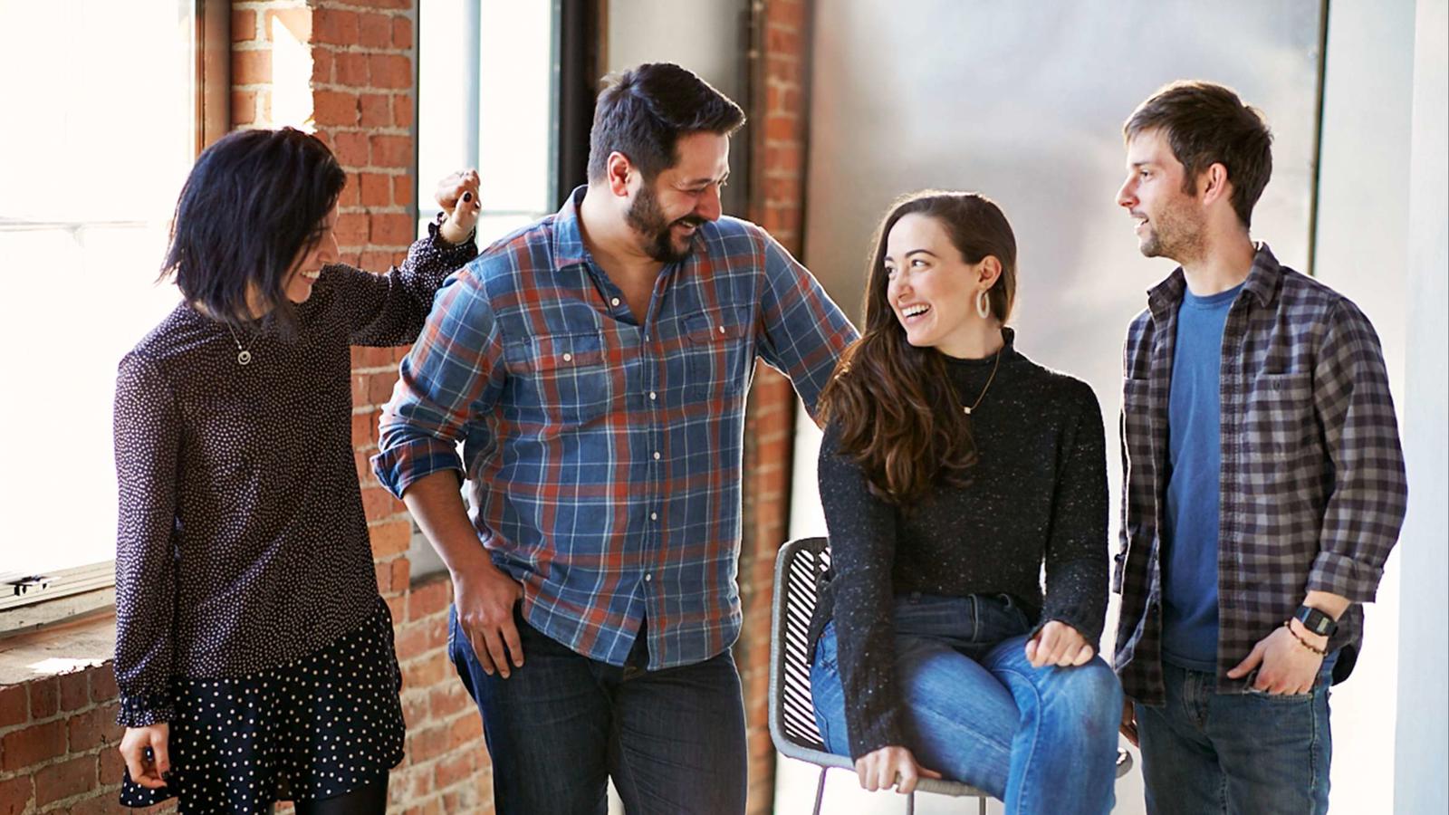 a group of people standing around a person