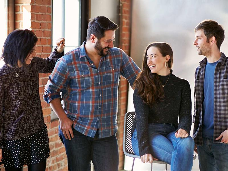 a group of people standing around a person