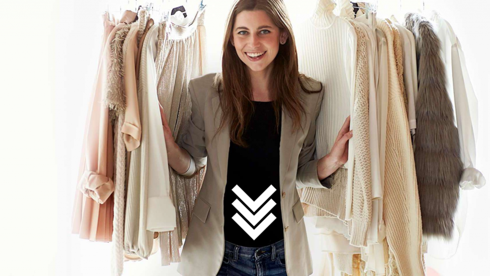 a person standing in front of a rack of clothes