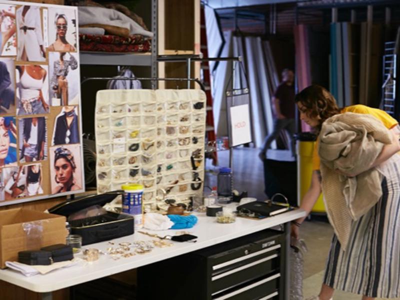 a person standing next to a table